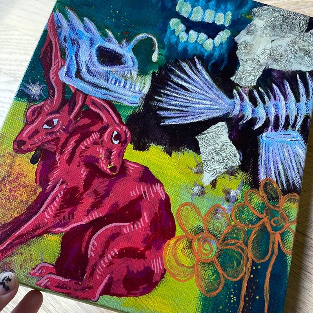 Close up of Whimsical, original mixed-media painting, trippy two-headed rabbit artwork, angler fish skeleton, teeth and gums, orange flowers.