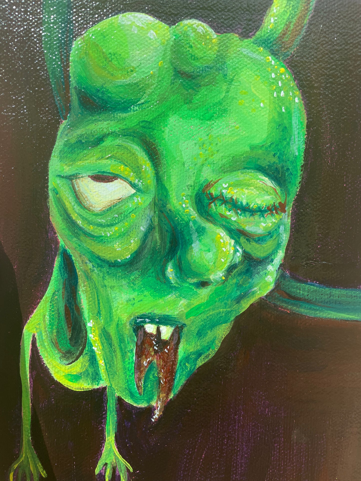 Close up of an original acrylic painting of a green monster dude by T00thFaerie Art on a 6” by 8” canvas. Painting features a green monster alien hanging down from above. The background is a very dark purple with some hints of brown as well.