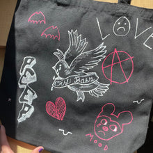 Load image into Gallery viewer, One-of-a-kind hand-painted Lil Peep-themed tote bag with hand-painted Lil Peep artwork! This tote bag is roughly 15” by 16” with a nice rectangular bottom - great as a reusable grocery bag, book bag, overnight bag - whatever. I used 3D fabric paint, so the design is textured and it is washable! 
