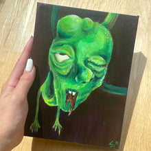 Load image into Gallery viewer, An original acrylic painting of a green monster dude by T00thFaerie Art on a 6” by 8” canvas! This fun, unique painting is sealed with varnish and since it is a stretched canvas it is very easy to hang. It’s easier to see in person but the background is actually a very dark purple with some hints of brown as well.
